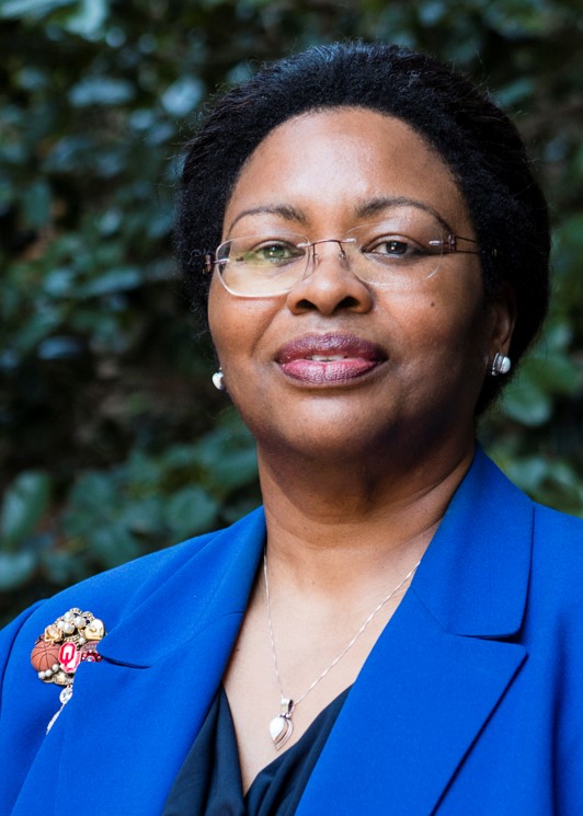 Front facing image of woman in a blue suit